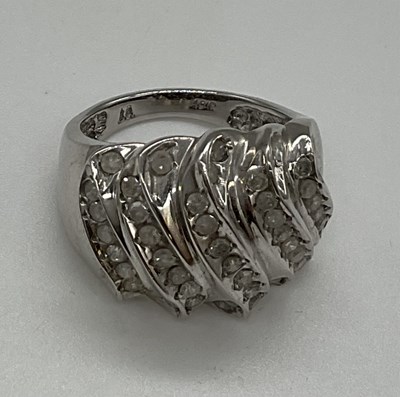 Lot 1216 - Two 9ct white gold dress rings, the larger...