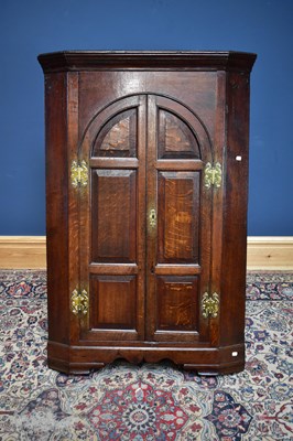 Lot 2541 - An 18th century freestanding corner cupboard,...