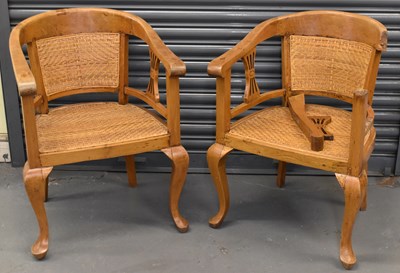 Lot 86 - A pair of Colonial style hardwood and rattan...