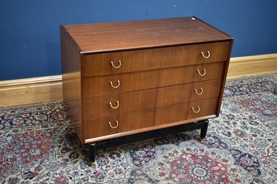 Lot 2565 - A mid century teak chest of four long drawers,...