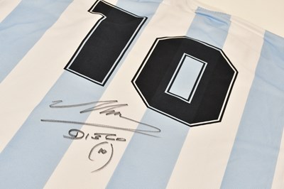 Lot 1277 - DIEGO MARADONA; a signed 1986 retro-style...