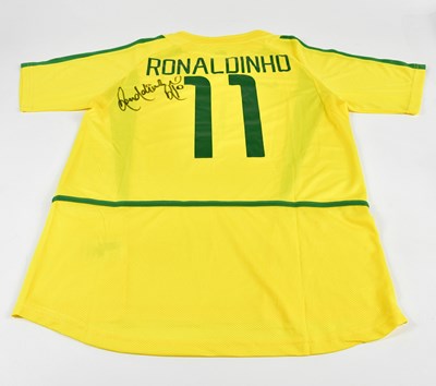 Lot 1270 - RONALDINHO; a signed 2002 Brazil retro-style...