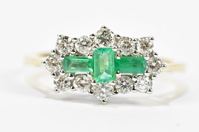 Lot 103 - A yellow metal emerald and diamond cluster...