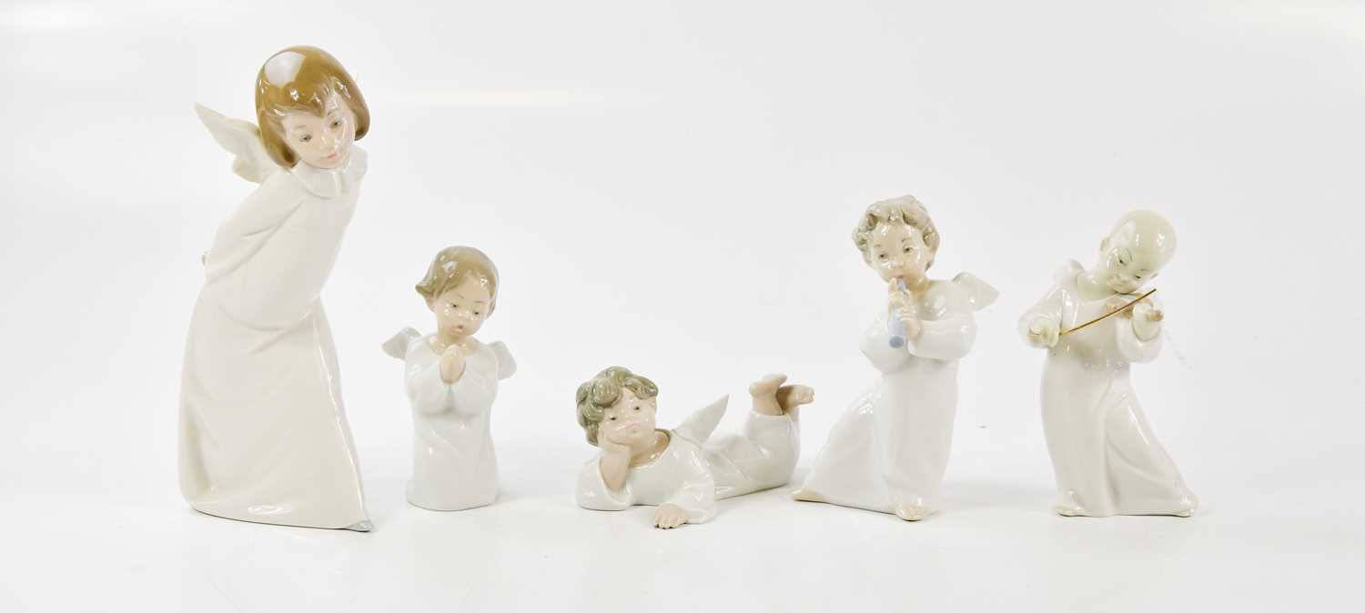 Lot 1412 - LLADRO; five Lladro figures of cherubs,...