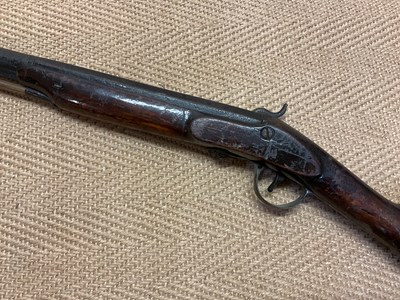 Lot 72 - A 19th Century flintlock rifle with mahogany...