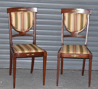 Lot 108 - A pair of Empire style side chairs with gilt...