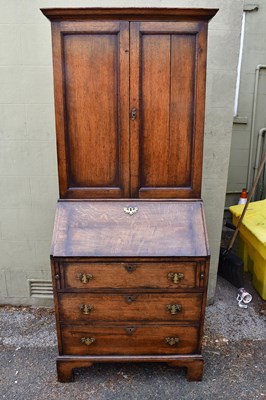 Lot 2538 - A reproduction oak bureau bookcase, width 82cm.