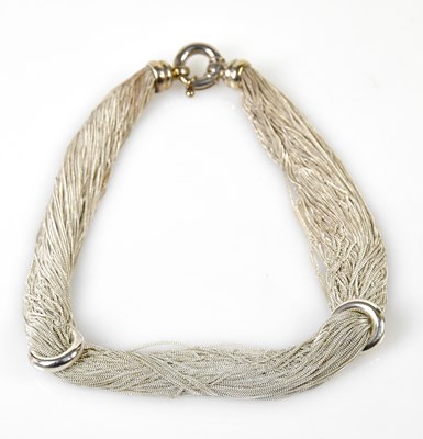 Lot 411 - An unusual silver fine link multi strand...