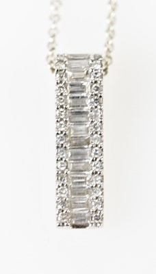 Lot 344 - A 14ct white gold baguette and round brilliant...