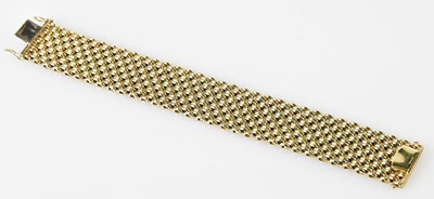 Lot 502 - A 9ct yellow gold textured broad flat link...