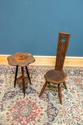 Lot 2491 - An Indian carved hardwood two tier occasional...