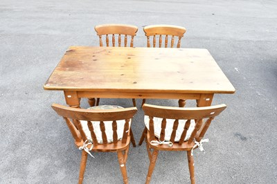 Lot 2604 - A modern pine rectangular dining table on...