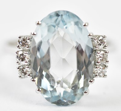 Lot 74 - An 18ct white gold aquamarine and six stone...