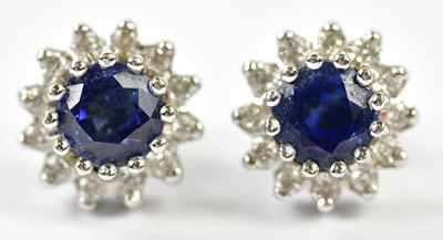 Lot 643 - A pair of 18ct white gold diamond and sapphire...