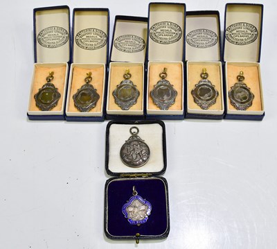 Lot 1073 - A group of six hallmarked silver medals, all...