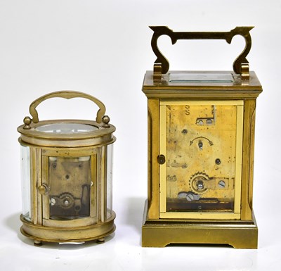 Lot 2257 - A brass cased carriage clock with white enamel...