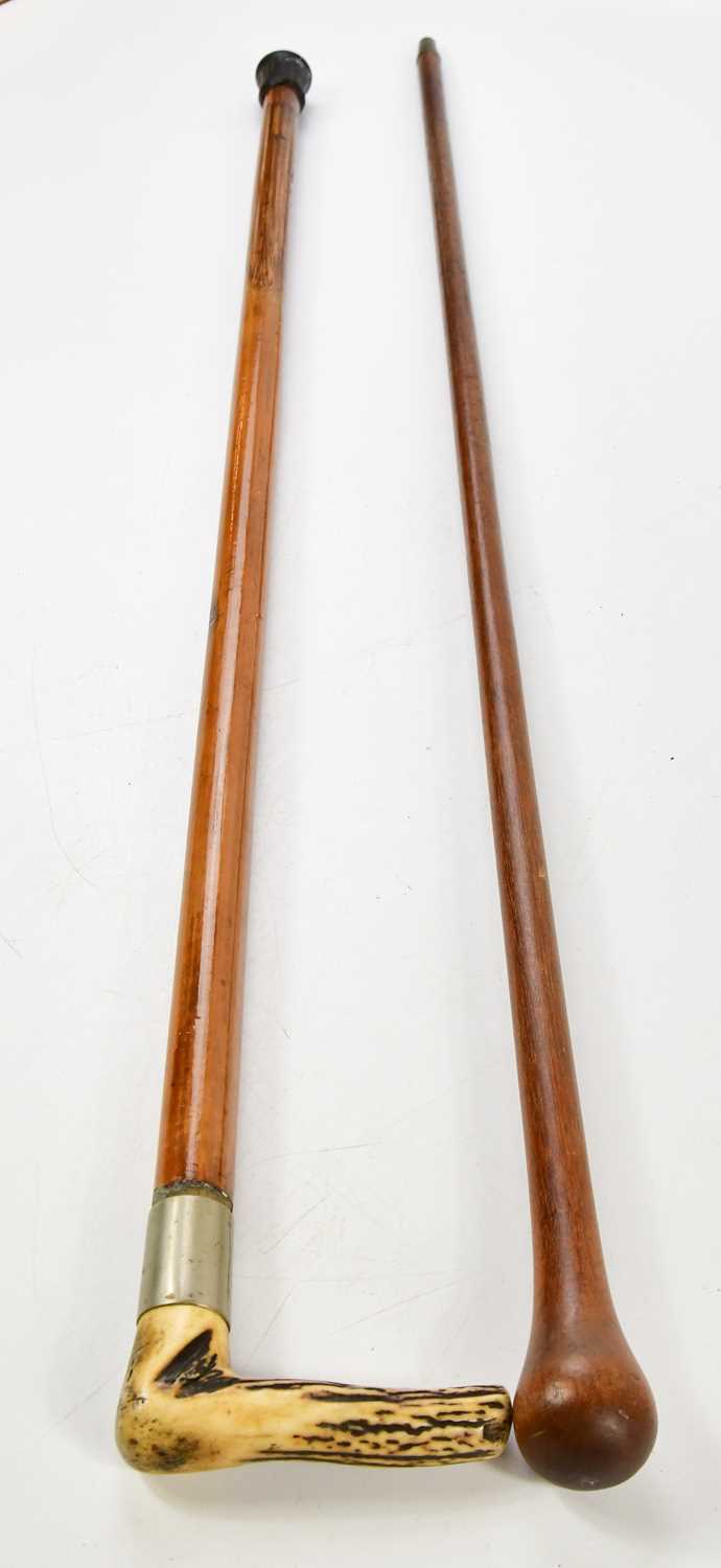 Lot 1083 - Two walking sticks, including a horn handled...