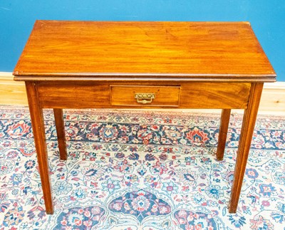 Lot 2537 - A Georgian mahogany fold over tea table with...