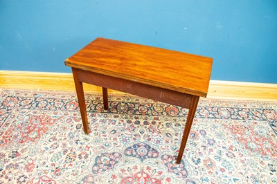 Lot 2537 - A Georgian mahogany fold over tea table with...