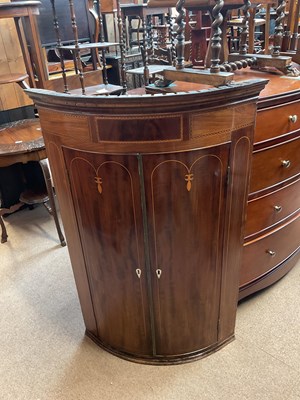 Lot 2466 - A Georgian inlaid mahogany bowfronted hanging...