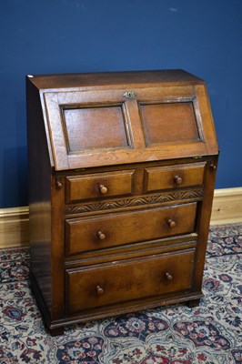 Lot 2602 - A reproduction oak bureau, the fall front...