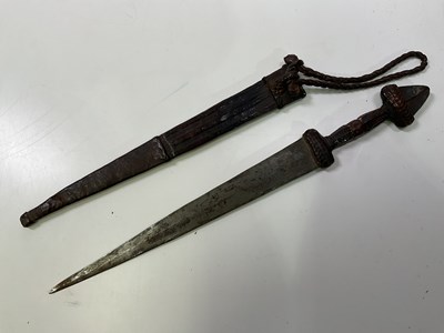 Lot 42 - An African dagger with leather and snakeskin...