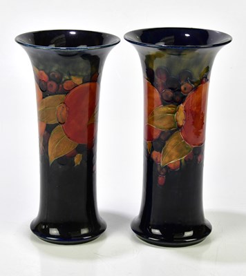 Lot 356 - WILLIAM MOORCROFT; a pair of sleeve vases...