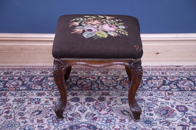 Lot 2427 - A Victorian carved walnut framed footstool...