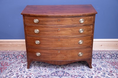 Lot 2371 - A Georgian inlaid mahogany chest of four...