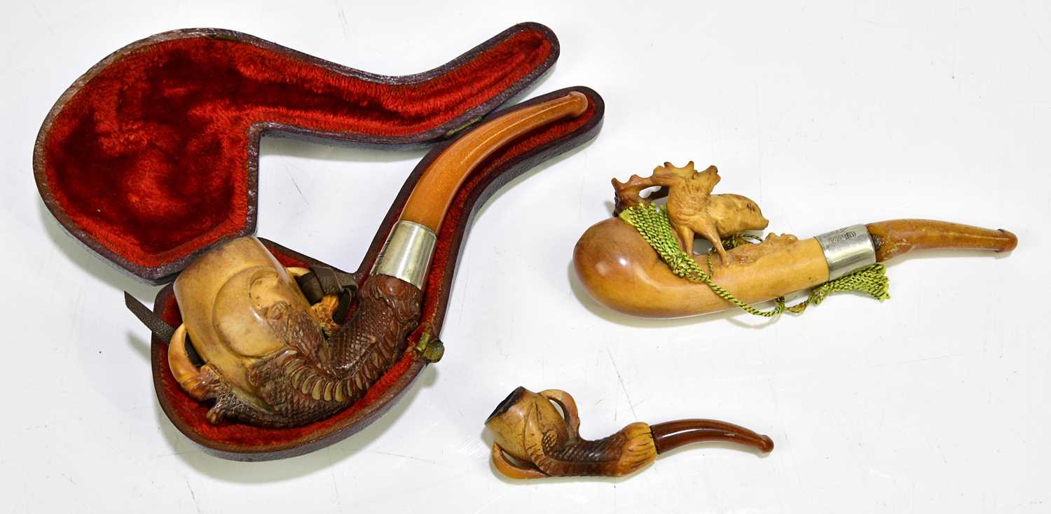 Lot 1053 Three late 19th century Meerschaum pipes,