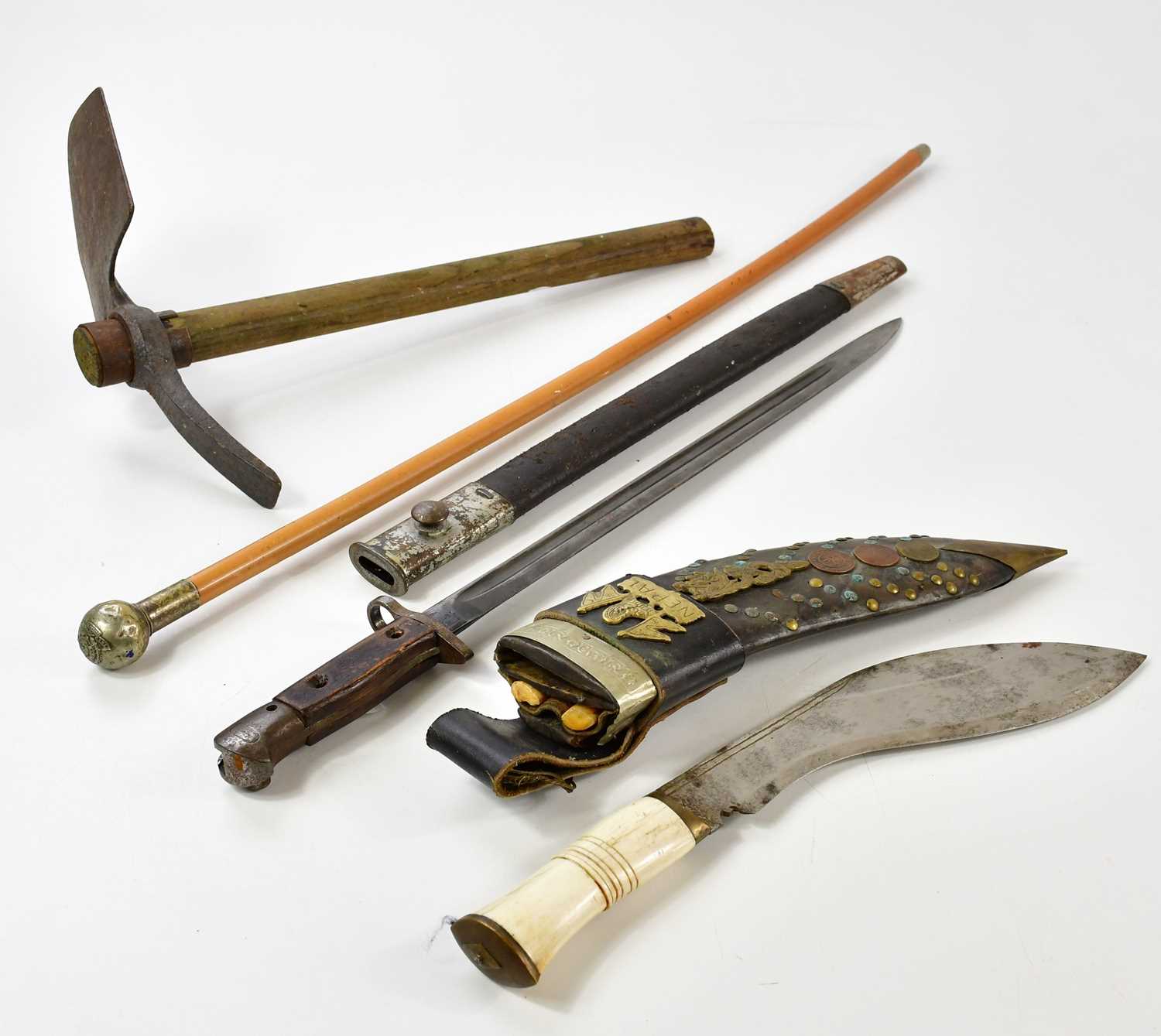 Lot 698 - A Gurka kukri knife with applied Nepal emblem...