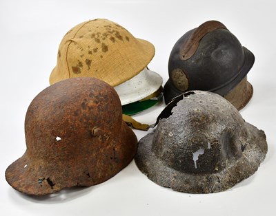 Lot 451 - Seven various military helmets including a...