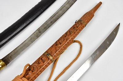 Lot 727 - An Indian sword with brass handle and carved...