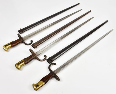 Lot 696 - Three French Gras bayonets with scabbards.