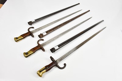 Lot 696 - Three French Gras bayonets with scabbards.