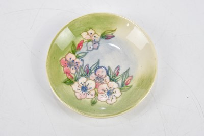 Lot 112 - MOORCROFT; four ceramic pin dishes including...