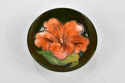 Lot 112 - MOORCROFT; four ceramic pin dishes including...