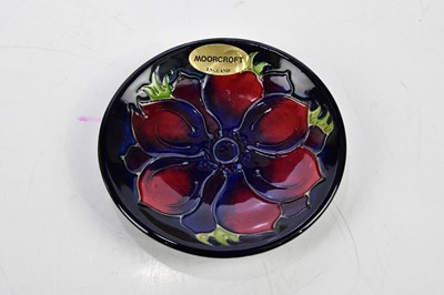 Lot 112 - MOORCROFT; four ceramic pin dishes including...