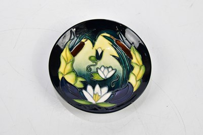 Lot 112 - MOORCROFT; four ceramic pin dishes including...