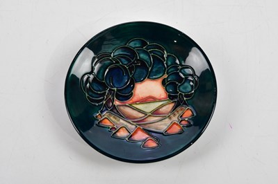 Lot 112 - MOORCROFT; four ceramic pin dishes including...