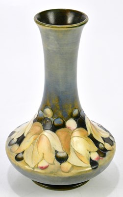 Lot 86 - WALTER MOORCROFT; a baluster vase with...