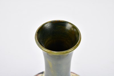 Lot 86 - WALTER MOORCROFT; a baluster vase with...