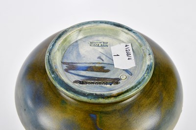 Lot 86 - WALTER MOORCROFT; a baluster vase with...