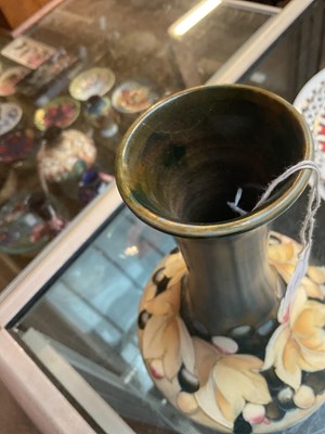 Lot 86 - WALTER MOORCROFT; a baluster vase with...