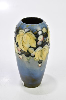 Lot 70 - WALTER MOORCROFT; two salt glazed vases...