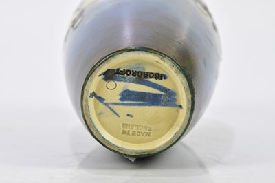 Lot 70 - WALTER MOORCROFT; two salt glazed vases...