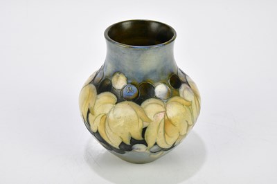 Lot 70 - WALTER MOORCROFT; two salt glazed vases...