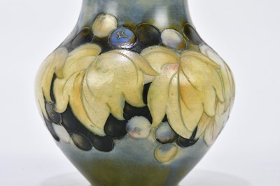 Lot 70 - WALTER MOORCROFT; two salt glazed vases...