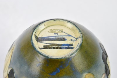 Lot 70 - WALTER MOORCROFT; two salt glazed vases...