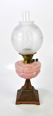 Lot 2235 - A pink marble effect hand blown 1930s oil lamp,...